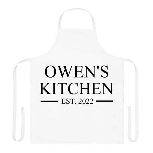 White apron with 'Owen's Kitchen EST. 2022' text on a white background