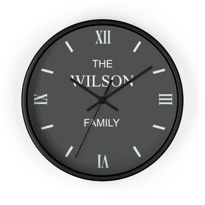Black wall clock with 'The Wilson Family' text on a white background