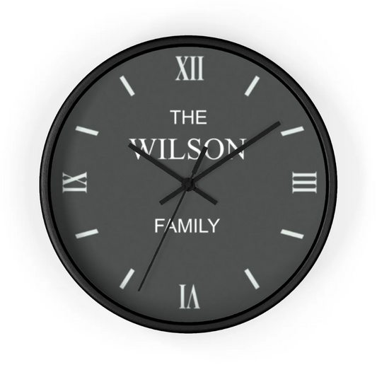 Black wall clock with 'The Wilson Family' text on a white background