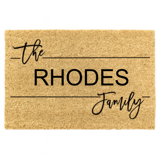 Doormat with 'the RHODES Family' text on a beige background