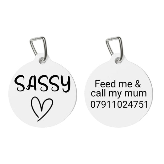 Two white pet tags with text on a white background