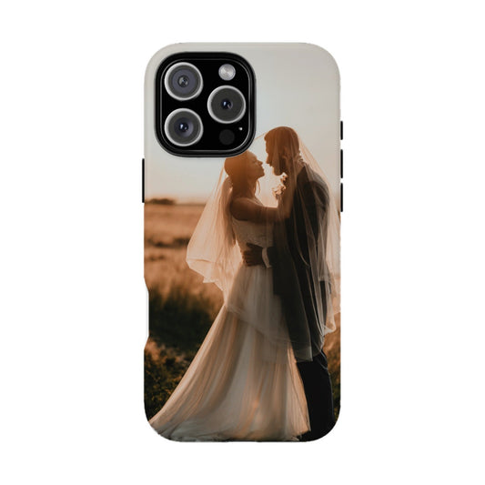 Phone case with a printed design of a couple embracing in a field.