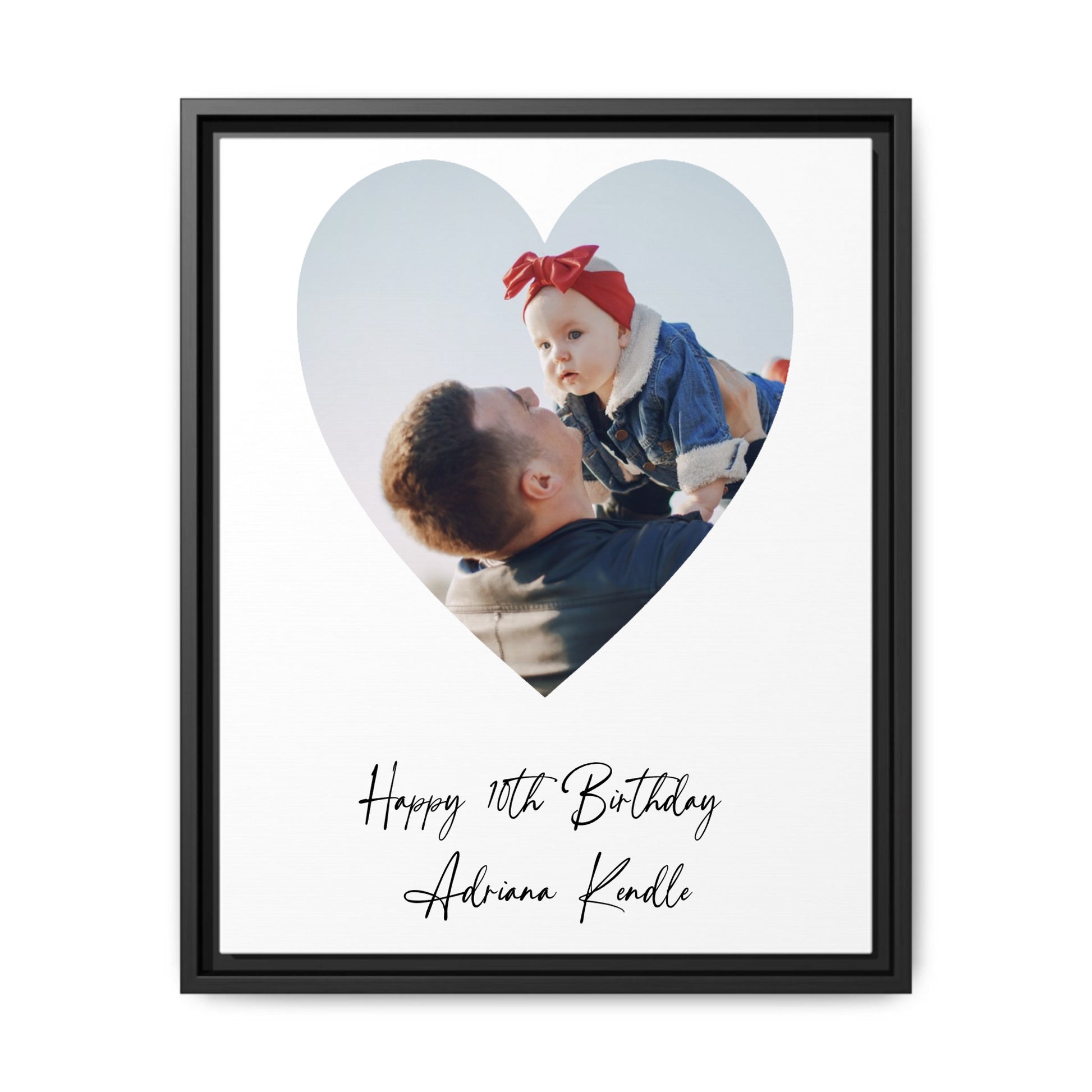 Heart-shaped photo frame with a heart design on a wall above a sofa