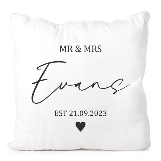 White pillow with 'MR & MRS Evans EST 21.09.2023' text on a white background